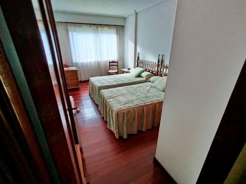 Postel nebo postele na pokoji v ubytování Vivienda Maceda