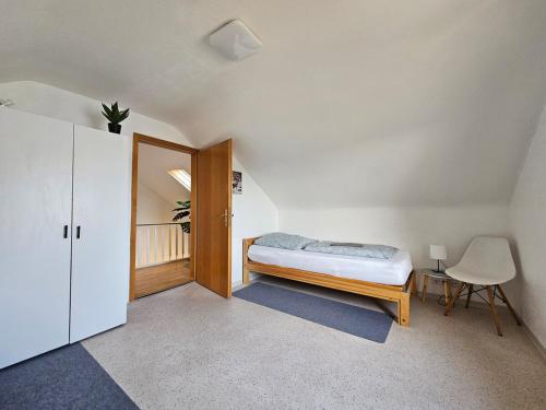 Katil atau katil-katil dalam bilik di Ferienhaus Süd Öhringen
