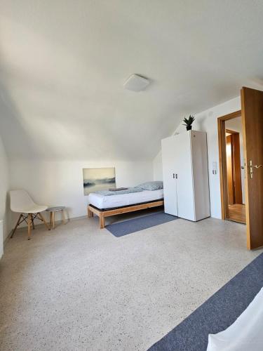 Katil atau katil-katil dalam bilik di Ferienhaus Süd Öhringen