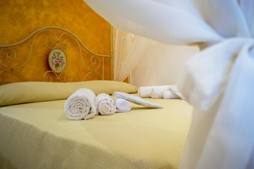 Katil atau katil-katil dalam bilik di Bed and Breakfast Camumidha