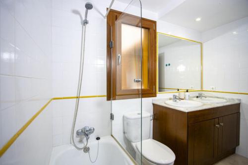 a bathroom with a shower and a toilet and a sink at La Recoleta ID198 in Cabo Roig