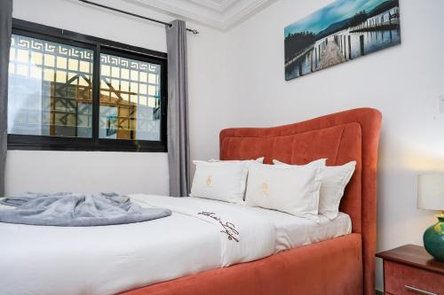 Un ou plusieurs lits dans un hébergement de l'établissement T-Square Residence Makepe