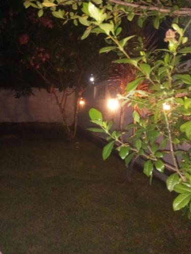 a van parked in a yard at night at Dishari Tangalle in Tangalle