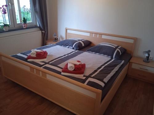 a bedroom with a bed with two towels on it at FeWo 3 Griese in Damnatz