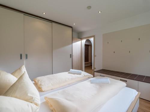 Postel nebo postele na pokoji v ubytování Ferienwohnanlage Oberaudorf F3 mit Hallenbad und Sauna