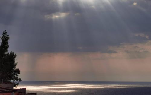 a view of the ocean under a cloudy sky at Aelia House Chalkidiki in Fourka