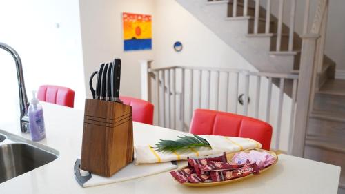 a kitchen counter with a knife block on a table at Newly Built 3 plus 1 bedroom Ravine lot Townhouse, Brampton, Ontario in Brampton