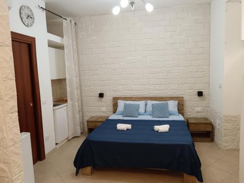 Ένα ή περισσότερα κρεβάτια σε δωμάτιο στο Baglieri appartament