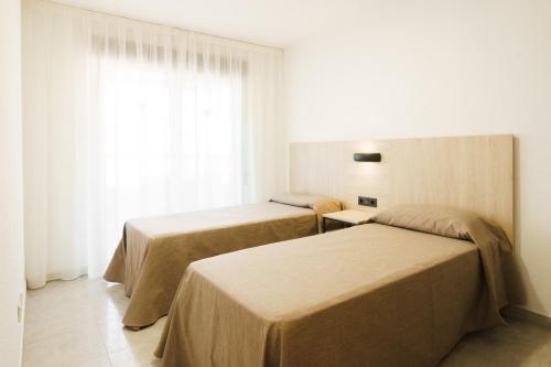 Postel nebo postele na pokoji v ubytování San Diego Apartments By Mc