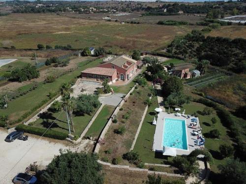 an aerial view of a house with a swimming pool at Al Palmento Relais in Siracusa