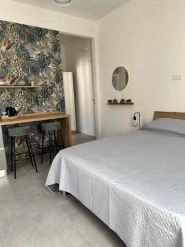 Ένα ή περισσότερα κρεβάτια σε δωμάτιο στο Studio Dolce Vita
