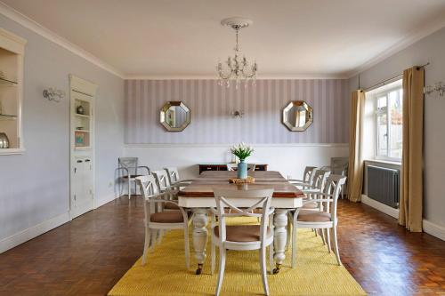 a dining room with a table and chairs at Finest Retreats - The Stables at Crimplesham in Stradsett