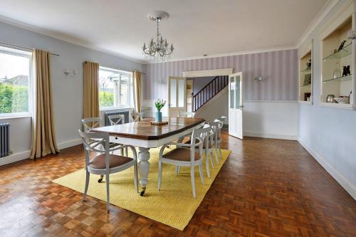 a dining room with a table and chairs at Finest Retreats - The Stables at Crimplesham in Stradsett