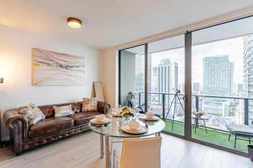 a living room with a couch and a table at Brickell Bay View in Miami