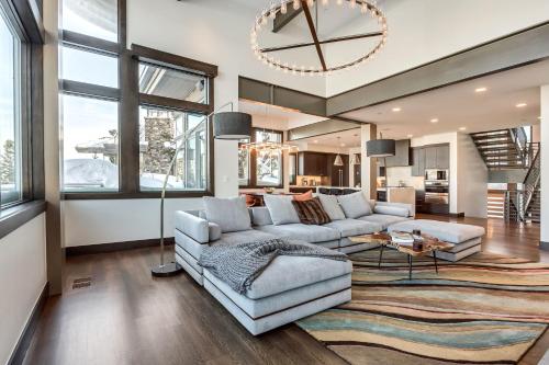 a living room with a couch and a table at Stein Eriksen Residences in Park City