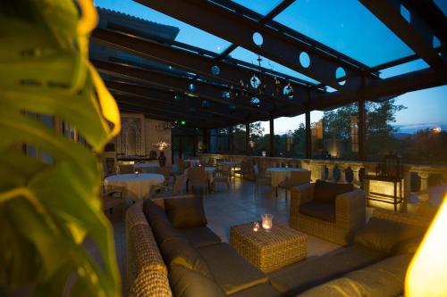a view of a restaurant with couches and tables at Château de Potelières in Potelières