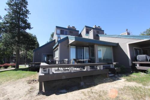 a house with a porch with chairs on it at LLC1236 - Lakeside Landing in South Lake Tahoe