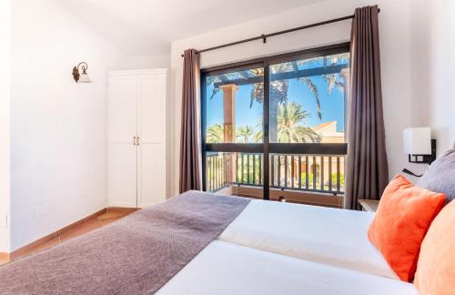 a bedroom with a bed and a large window at Bakour Fuerteventura La Pared in La Pared