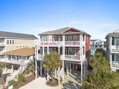 an aerial view of a house with palm trees at Cherry Bomb Private heated Pool, Elevator in Ocean Isle Beach