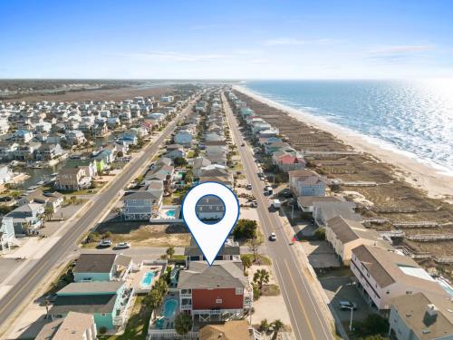 a view of a beach with a blue arrow pointing to a city at Cherry Bomb Private heated Pool, Elevator in Ocean Isle Beach