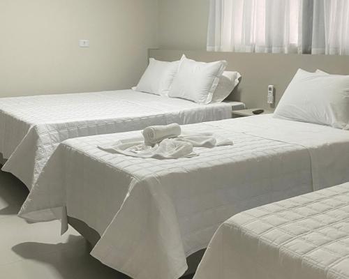 Postel nebo postele na pokoji v ubytování Hotel Marechal Express
