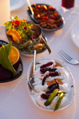 a table with three plates of food on it at Hotel Delta in Fethiye