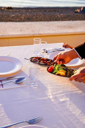 a table with plates of food on top at Hotel Delta in Fethiye