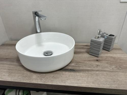 a white sink sitting on top of a counter at B&B Giumà in Paestum