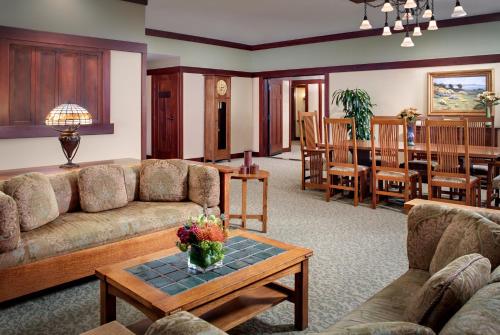 a living room with a couch and a table at The Lodge at Torrey Pines in San Diego