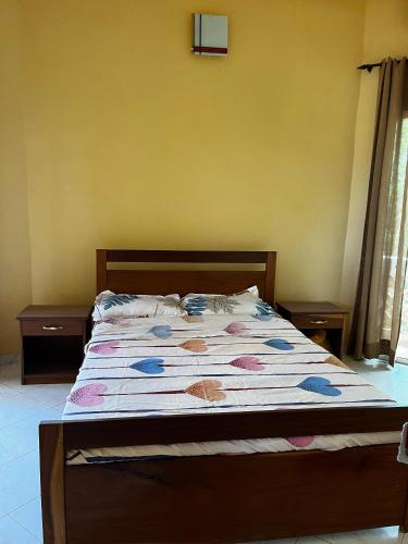 a large bed in a bedroom with at Villa Artcanes in Toubab Dialaw
