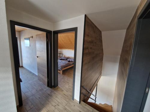 a hallway with a door leading to a bedroom at Relax Vila Lipno 1 u pláže Windy Point in Černá v Pošumaví