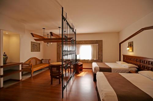 Postel nebo postele na pokoji v ubytování Hotel de Mendoza