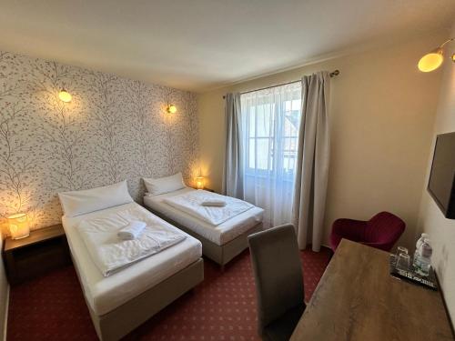 Un ou plusieurs lits dans un hébergement de l'établissement Hotel Brixen