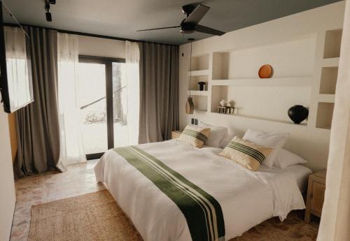 Postel nebo postele na pokoji v ubytování Ixum, Casa Hotel Boutique