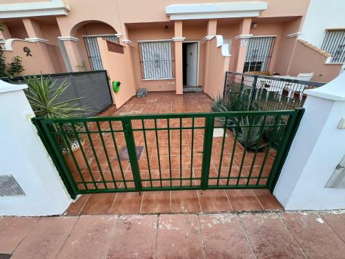 a gate in front of a house at Villa Terreros 67 in San Juan de los Terreros