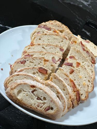 three slices of bread on a white plate at Hotel Alendouro in Macedo de Cavaleiros