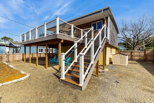 a house with a staircase leading up to it at Elli's Haus in Rockaway Beach
