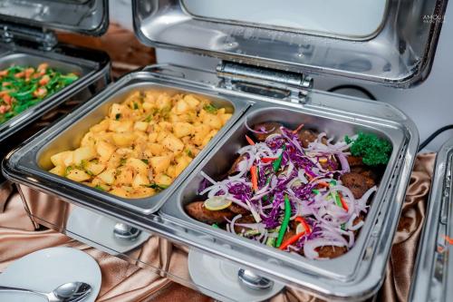 a lunch box filled with food in a refrigerator at River Arc Bolgoda Villa in Panadura