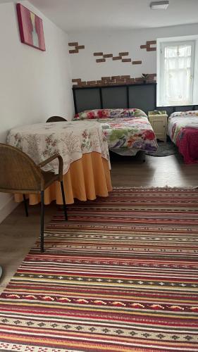 a room with two beds and a rug at Zubizar in Morga