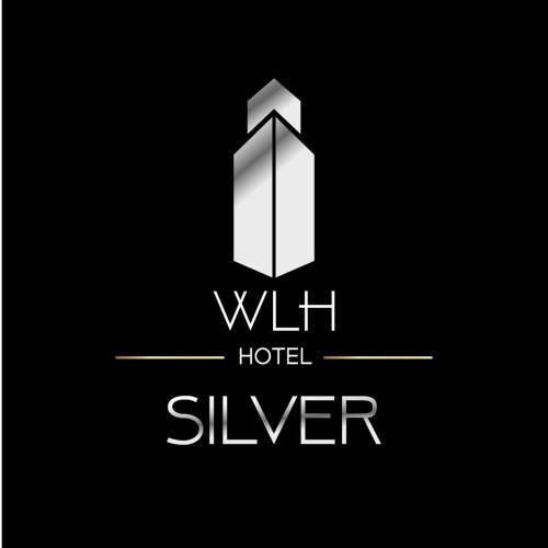 a white hotel sliver logo on a black background at Hotel WLH Silver Corferias in Bogotá