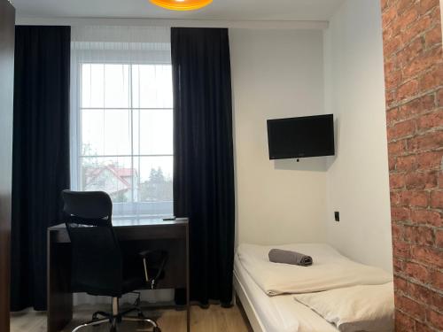 Televisyen dan/atau pusat hiburan di Hostel Przed Świtem