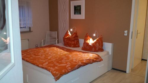 a bed with two bags with lights on it at Logis Am Park in Dessau