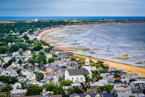 an aerial view of a beach with houses and the ocean at Condo with Wading Pool Dog Welcome in Provincetown