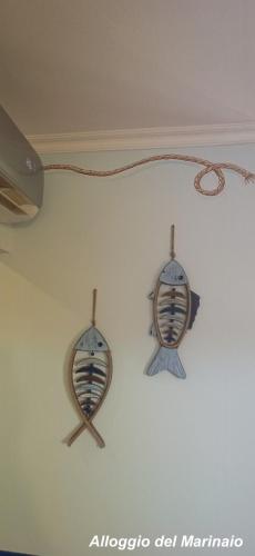 three spoons hanging on a white wall at Alloggi Turistici con Piscina Palestra Jacuzzi Sauna - All Inclusive in Anzio