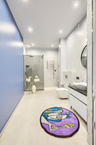 a bathroom with a mermaid rug on the floor at Botanic Towers the house has a shelter in Kyiv