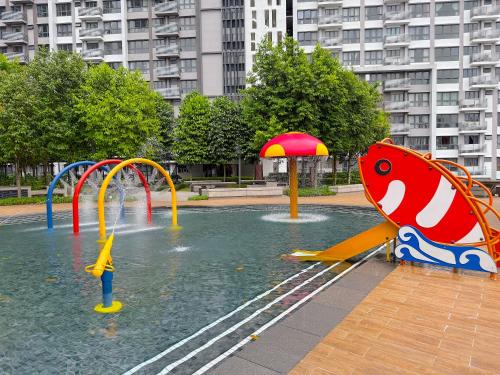 a pool with a water park with a water slide at M Vertica Cheras by RASBO Galaxy Suites in Kuala Lumpur