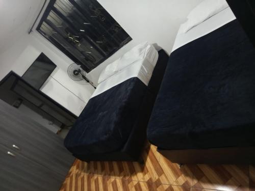 a black and white couch in a room with a window at Finca hotel el guadual- QUINDIO-EJE CAFETERO in Quimbaya