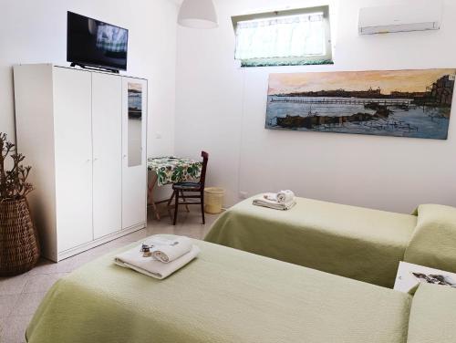 Ένα ή περισσότερα κρεβάτια σε δωμάτιο στο Ficodindia Rooms