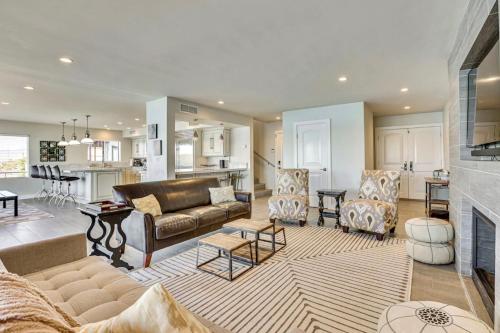 a living room with a couch and a kitchen at Riverfront Luxury Retreat in Parker