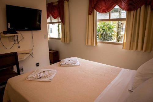 Cama ou camas em um quarto em Hotel Rio Penedo